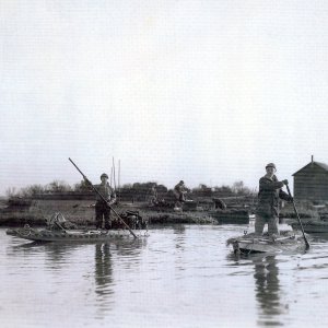 43 Walter Cook Jr and Walter Cook Sr poling from early Pelican Island shack - HUNT.jpg