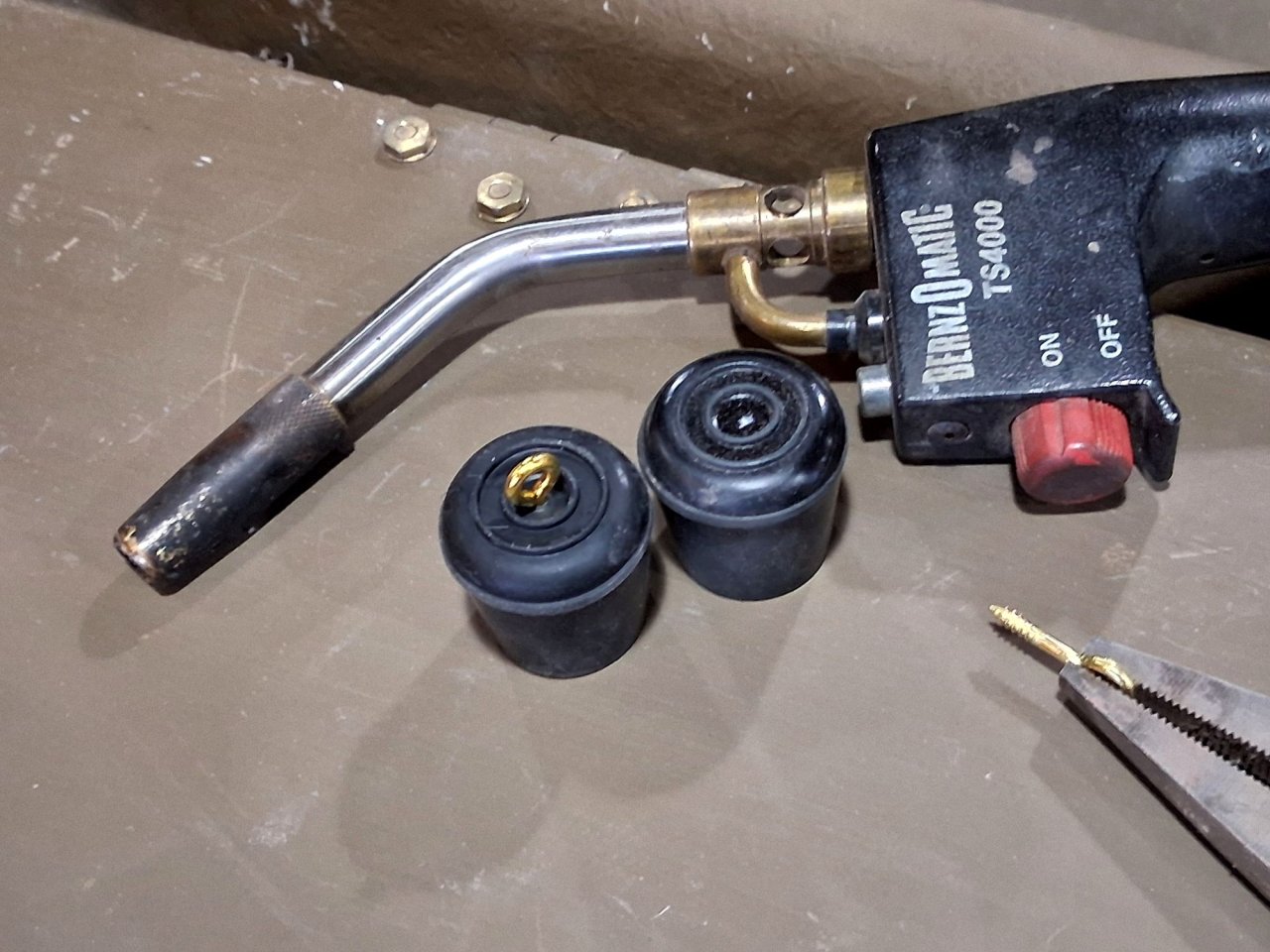 P - Tierney - brass screw eyes in rubber caps.jpg